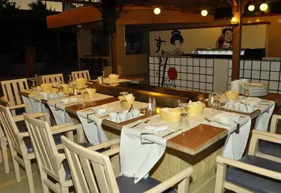 a dining room with a long table and chairs at Giftun Azur Resort in Hurghada