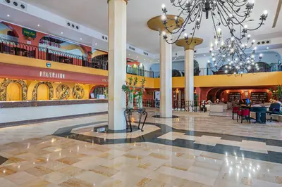 a large lobby with a chandelier in a shopping mall at Arabia Azur Resort in Hurghada