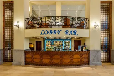 a lobby of a hotel with a bar at JAZ Palmariva Beach in Hurghada