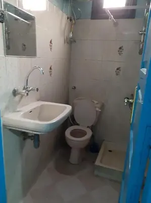 a bathroom with a toilet and a sink at Oasis hotel in Luxor