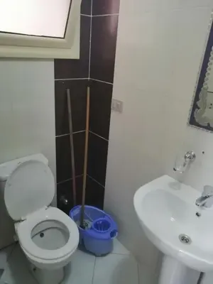 a bathroom with a toilet and a sink at Nour Plaza Hurghada النور بلازا الغردقة in Hurghada