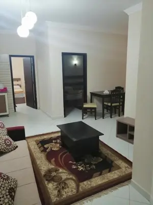 a living room with a couch and a table at Nour Plaza Hurghada النور بلازا الغردقة in Hurghada