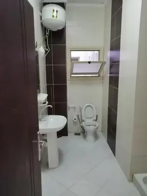 a bathroom with a toilet and a sink at Nour Plaza Hurghada النور بلازا الغردقة in Hurghada