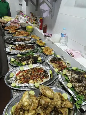 a buffet line with many plates of food at Nour Plaza Hurghada النور بلازا الغردقة in Hurghada