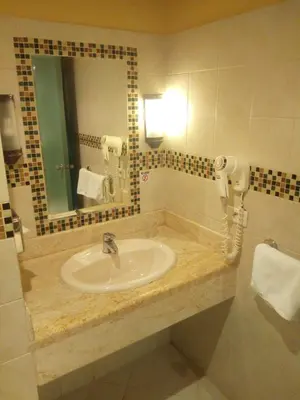 a bathroom with a sink and a mirror at EL Gouna Abu tig marina studio- economy stay in Hurghada