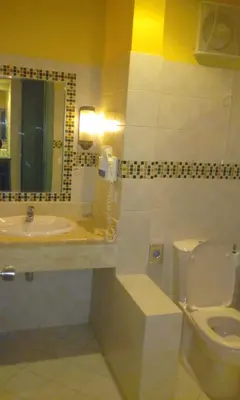 a bathroom with a toilet and a sink and a mirror at EL Gouna Abu tig marina studio- economy stay in Hurghada