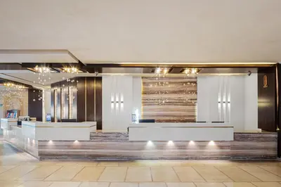 a lobby of a hotel with a reception desk at Pickalbatros Citadel Resort Sahl Hasheesh in Hurghada