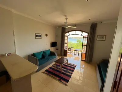 a living room with a couch and a table at Luxor Plaza House in Luxor