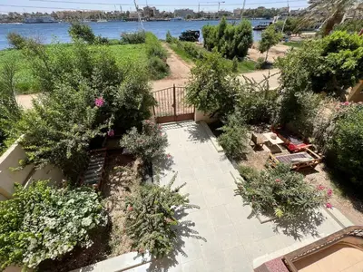 an overhead view of a garden with trees and flowers at Luxor Plaza House in Luxor