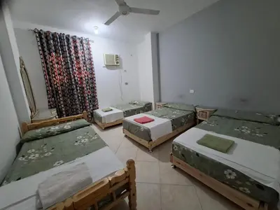 a group of four beds in a room at david hostel in Aswan