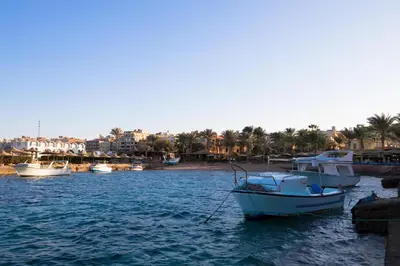 a group of boats in a body of water at Sand Beach Resort in Hurghada