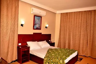 a hotel room with a bed and a window at Sand Beach Resort in Hurghada