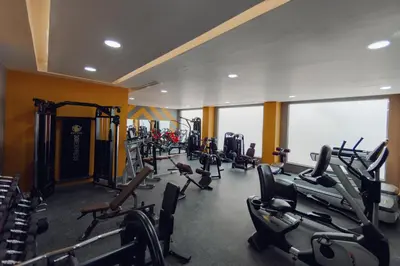 a gym with a bunch of treadmills and machines at Bellagio Beach Resort & Spa in Hurghada