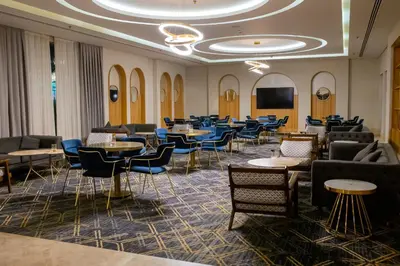 a waiting room with tables and chairs at Bellagio Beach Resort & Spa in Hurghada
