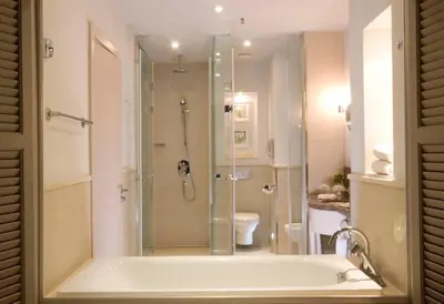 a bathroom with a shower and a bath tub at Old Palace Resort Sahl Hasheesh in Hurghada