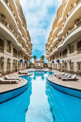 a swimming pool in the middle of a building at Nour Plaza Hurghada Studio Sea view in Hurghada