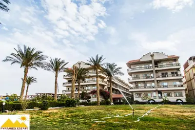a kite is flying in front of a building at Nour Plaza Hurghada Studio Sea view in Hurghada