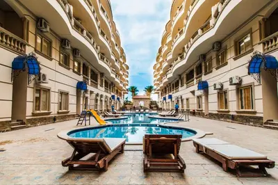 a pool in the middle of a building at Nour Plaza Hurghada Studio Sea view in Hurghada