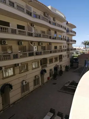 a building with balconies on the side of it at Nour Plaza Hurghada Studio Sea view in Hurghada