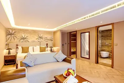 a living room with a couch and a bed at Sonesta St George Nile Cruise - Aswan to Luxor 3 Nights from Friday to Monday in Aswan