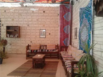 a room with couches and a table in a building at Nile Valley Hotel in Luxor
