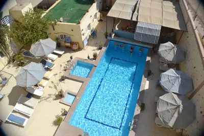an overhead view of a swimming pool with umbrellas at Nile Valley Hotel in Luxor