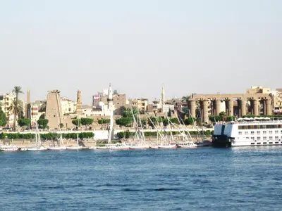 a group of boats are docked in a harbor at Nile Valley Hotel in Luxor