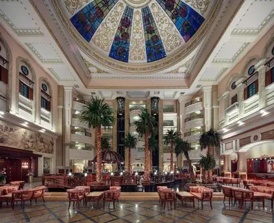 a large lobby with a large stained glass ceiling at Palm Royale Resort - Soma Bay in Hurghada