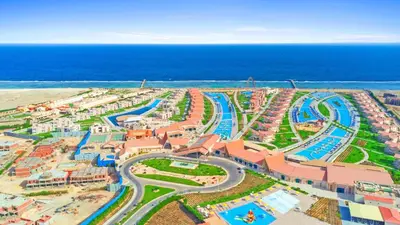 an aerial view of a water park next to the ocean at Pickalbatros Sea World Resort - Marsa Alam- 