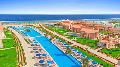 an aerial view of a resort with a pool at Pickalbatros Sea World Resort - Marsa Alam- 