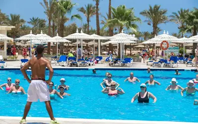 a group of people in the swimming pool at a resort at Mirage Bay Resort & Aqua Park in Hurghada