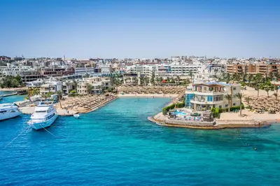 an aerial view of a beach with boats in the water at Seagull Beach Resort - Families and Couples Only in Hurghada
