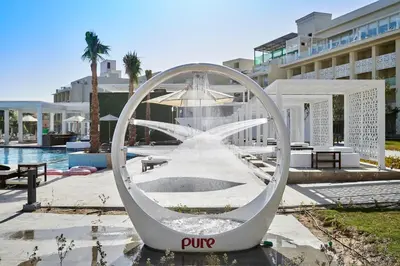 a large water fountain in front of a building at Steigenberger Pure Lifestyle (Adults Only) in Hurghada