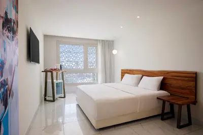 a bedroom with a white bed and a window at Steigenberger Pure Lifestyle (Adults Only) in Hurghada