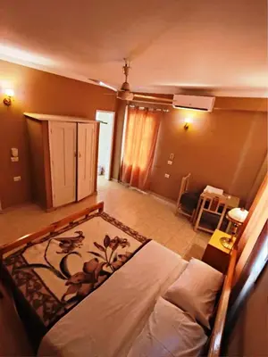 a bedroom with a bed in a room at Kareem Hotel Luxor in Luxor