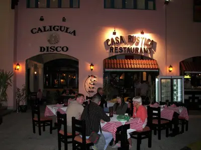a group of people sitting at tables in a restaurant at Le Pacha Resort in Hurghada