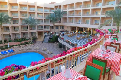 an aerial view of the resort with a swimming pool and a hotel at Sea Star Beau Rivage Hotel in Hurghada