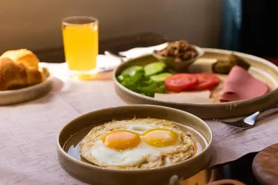 a table with two bowls of food with eggs and vegetables at M/S Esmeralda Nile Cruise - 4 or 7 Nights From Luxor each Monday and 03 Nights From Aswan each Friday in Luxor