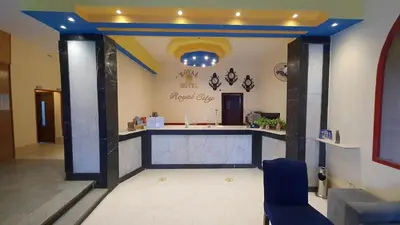 a lobby with a reception desk in a building at Royal City Hotel in Hurghada