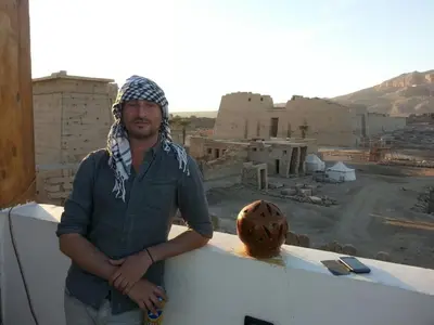a man standing on top of a building at Shahhat House in Luxor