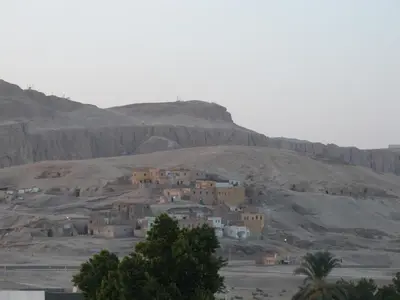 a group of houses on a hill in the desert at Shahhat House in Luxor