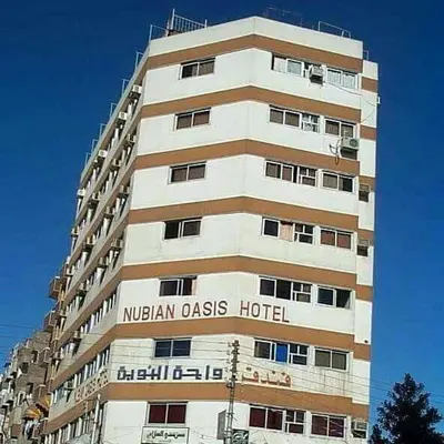a building with the words nigerianass hotel on it at Nubian oasis hotel in Aswan
