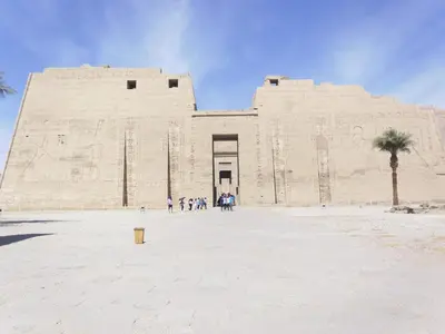 a large building with people standing in front of it at Nile Cruise King Tut in Luxor