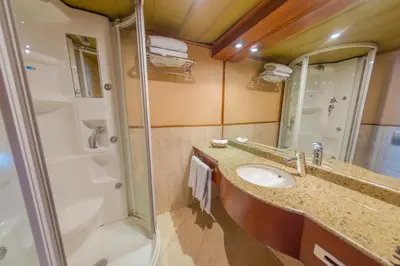 a bathroom with a sink and a shower at Nile Cruise King Tut in Luxor