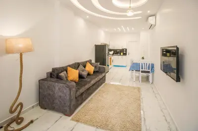 a living room with a couch and a table at SeaView Turtles in Hurghada