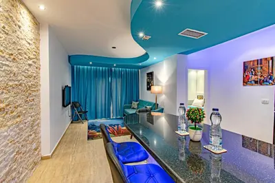a living room with a blue ceiling at SeaView Turtles in Hurghada