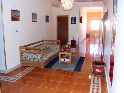 a living room with a couch and a table at Ali Baba Safaga Hotel in Hurghada