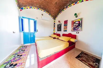 a bedroom with a bed in a room at Bob Marley Guest House in Aswan