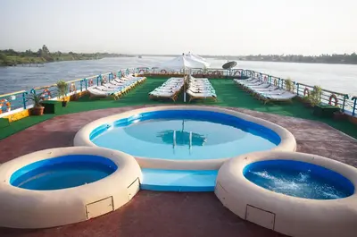 a cruise ship with two large swimming pools on the deck at Nile Carnival Cruise 4nt Lxr Thursday 3nt Asw Monday in Luxor