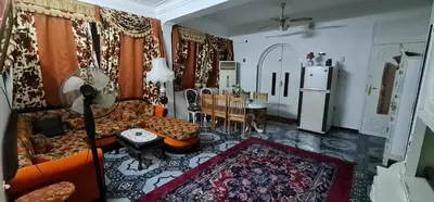 a living room with a couch and a table at Nuba Dool in Aswan